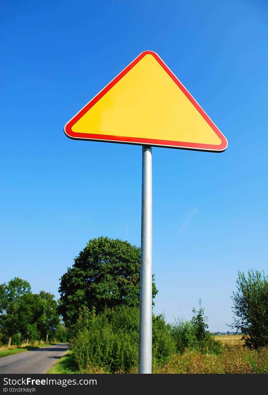 Road sign on the blue sky