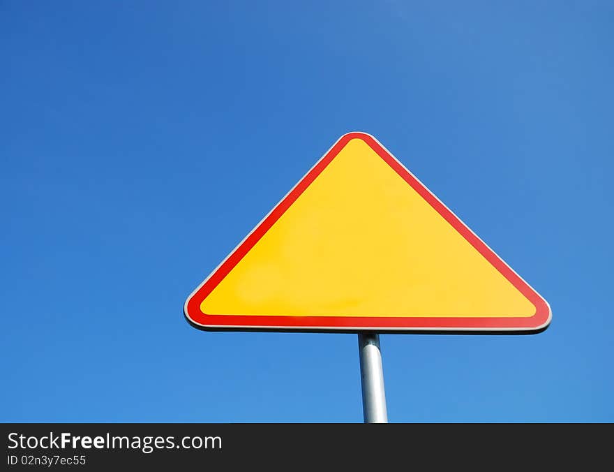 Road sign on the blue sky