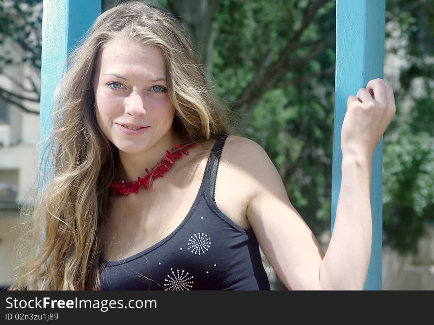 Beaty on a swing in a park. Beaty on a swing in a park