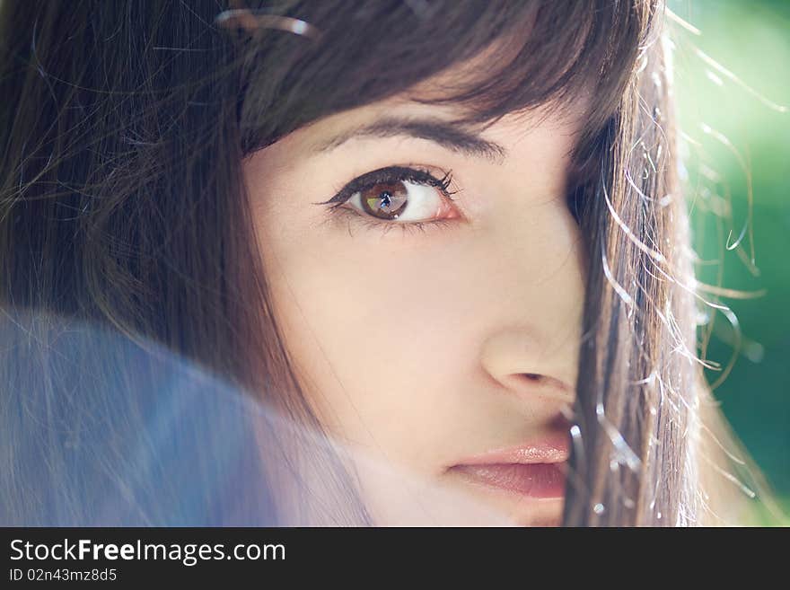 Young beautiful girl with long black hair, outdoors