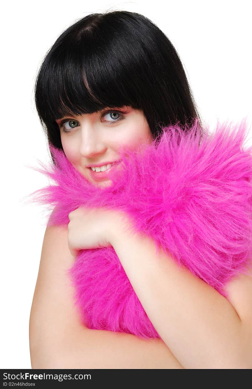 Funny close-up shot of a cute brunette girl embracing  the fluffy heart-shaped pillow. Isolated ower white. Funny close-up shot of a cute brunette girl embracing  the fluffy heart-shaped pillow. Isolated ower white