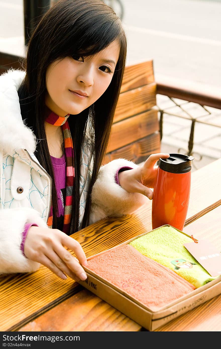 Beautiful girl sitting on bench