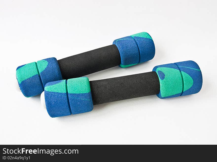 Two dumbbells on white background