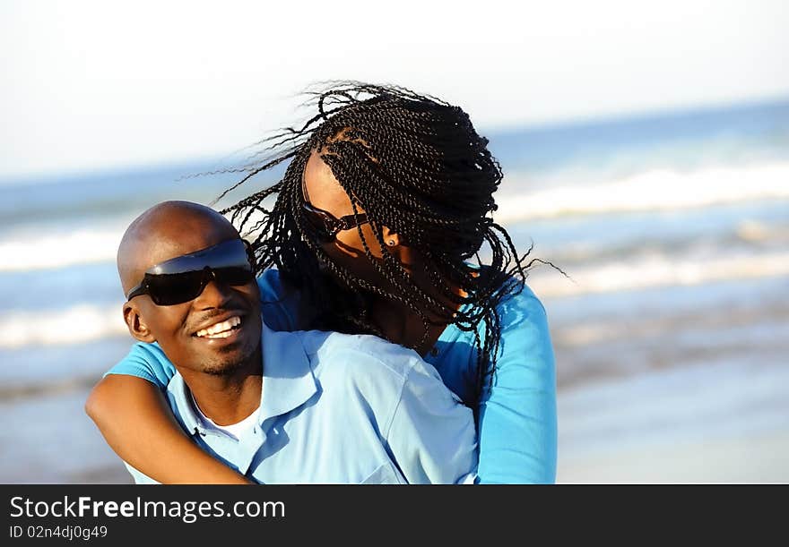 Happy African American couple enjoy the beach. Happy African American couple enjoy the beach