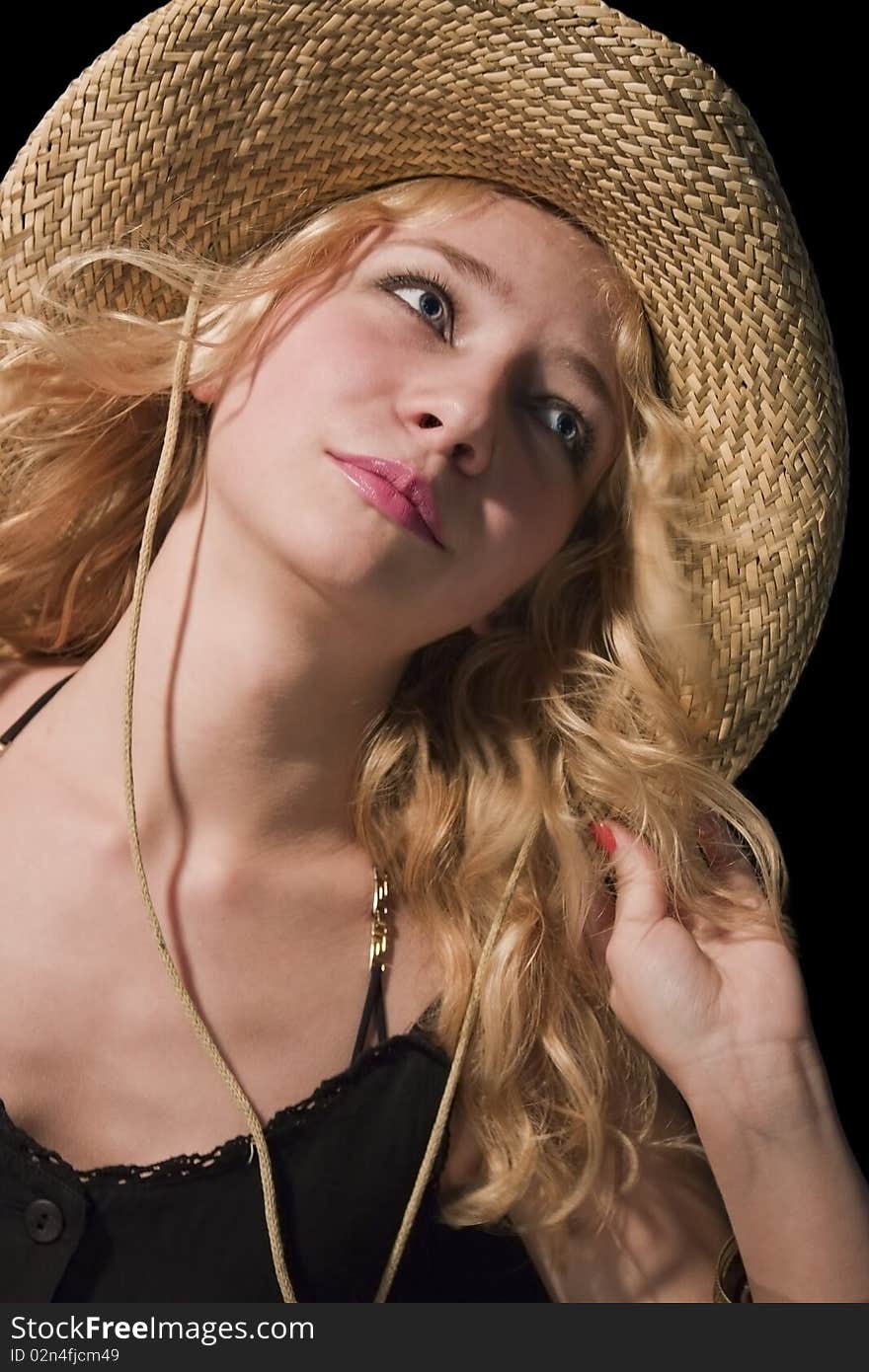 Portrait of young woman in the black background