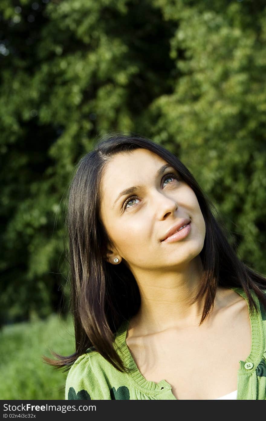 Beautiful young woman outdoors in nature. Portrait. Beautiful young woman outdoors in nature. Portrait