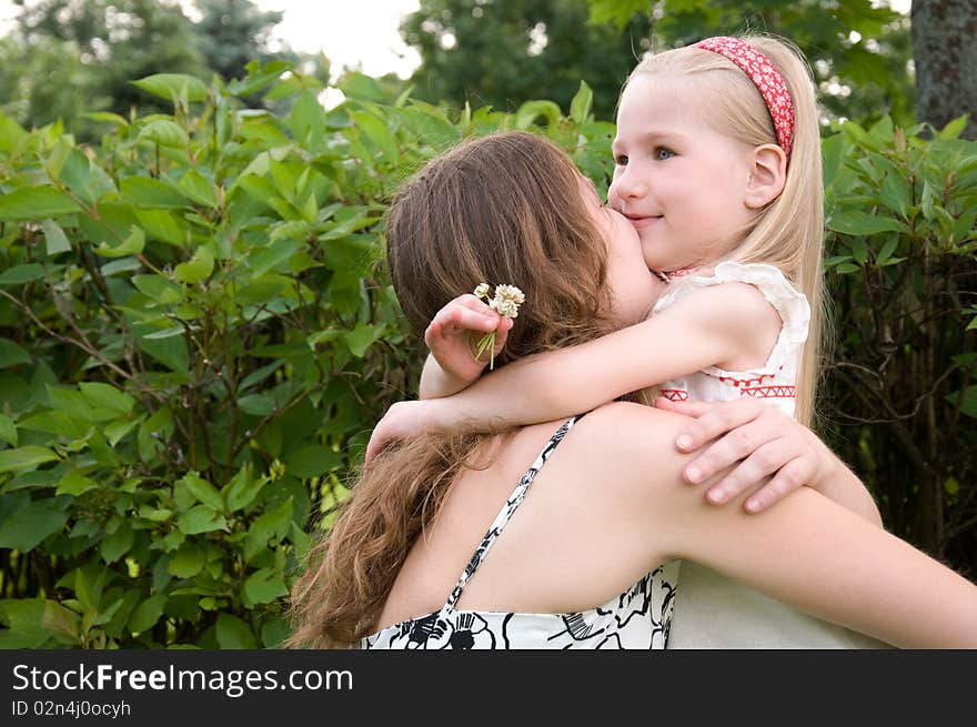 Embrace of mother and daughter. Embrace of mother and daughter