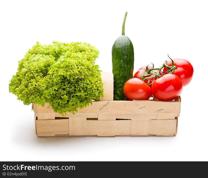 Juicy vegetables in punnet on white background