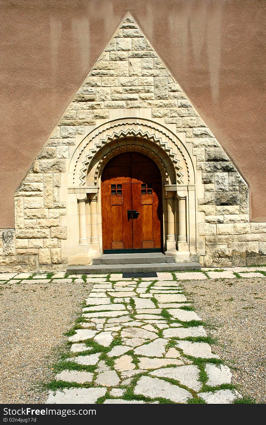 Old elegant vintage door entrance with stone pathway