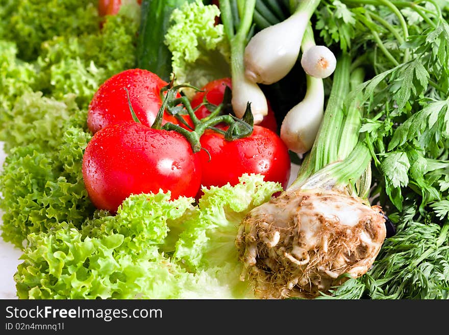 Organic raw vegetables on white background