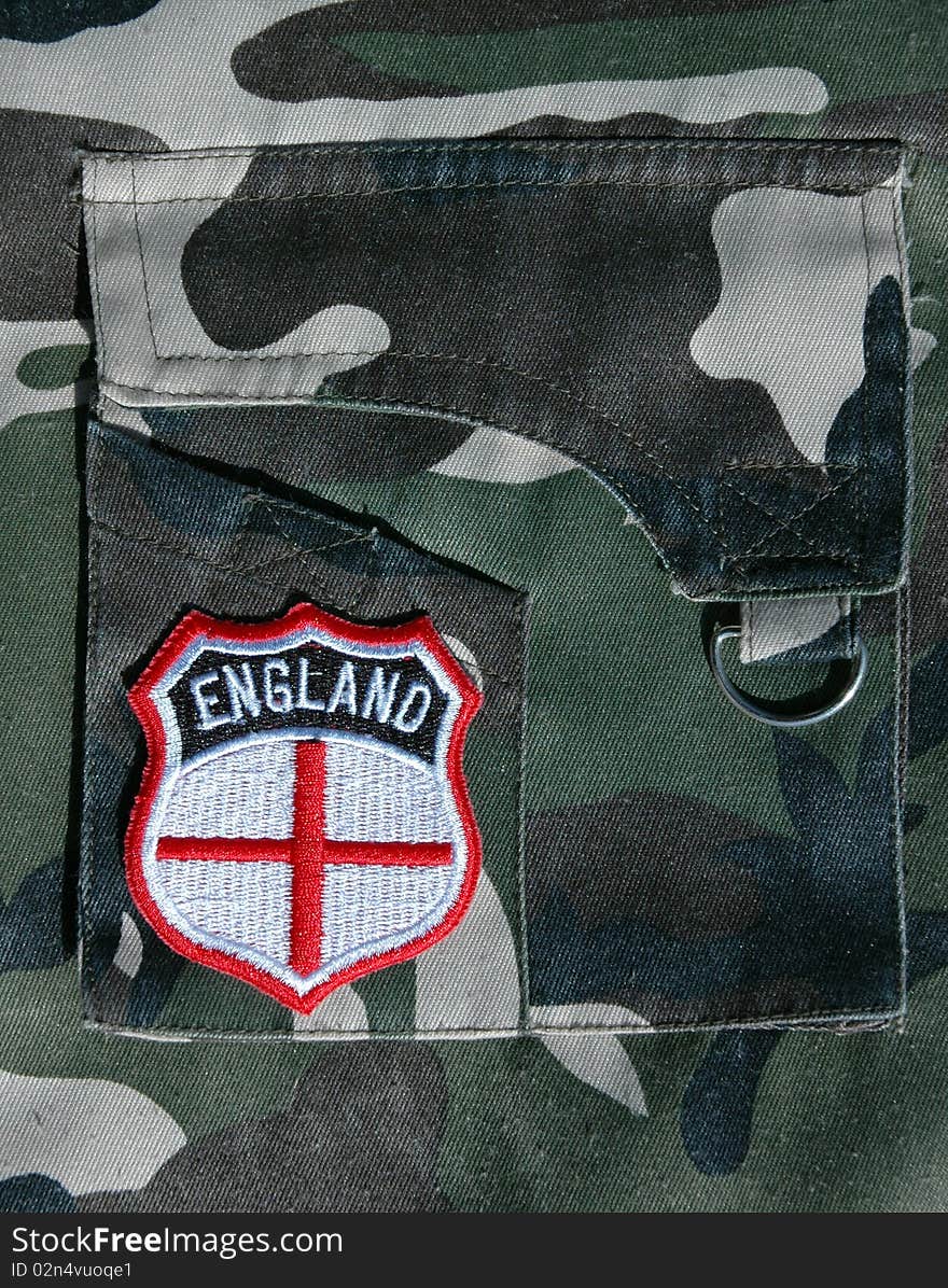 An England supporters badge on the pocket of a military style garment. An England supporter or military concept. An England supporters badge on the pocket of a military style garment. An England supporter or military concept.