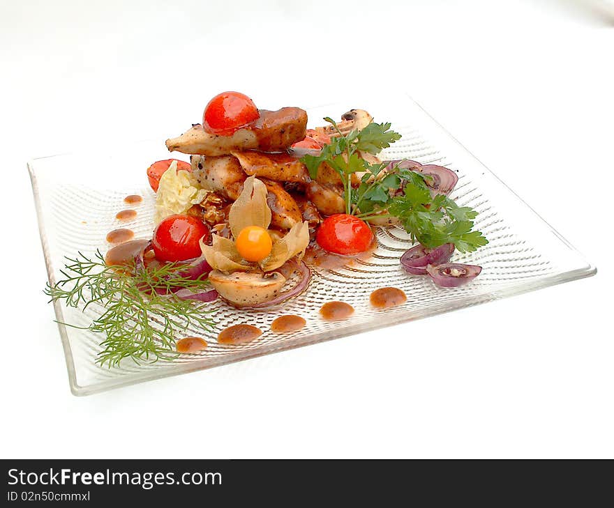 The glass plate with The Milfoy under sauce Demi Glass. The dish is decorated with pieces of Cherry tomatoes and sprig greenery. National classical dish in Courchevel traditions.