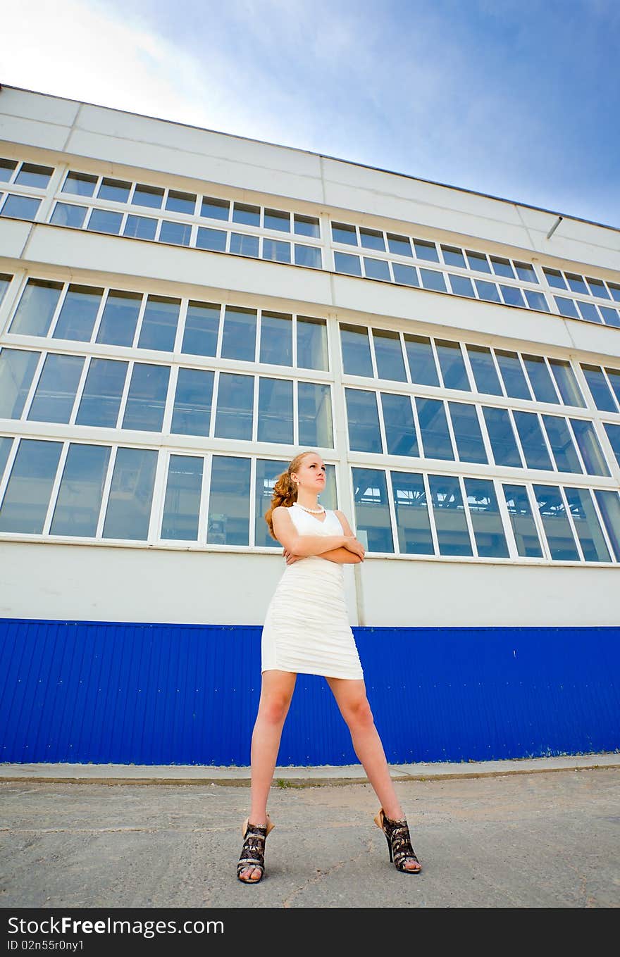 Girl posing over old factory