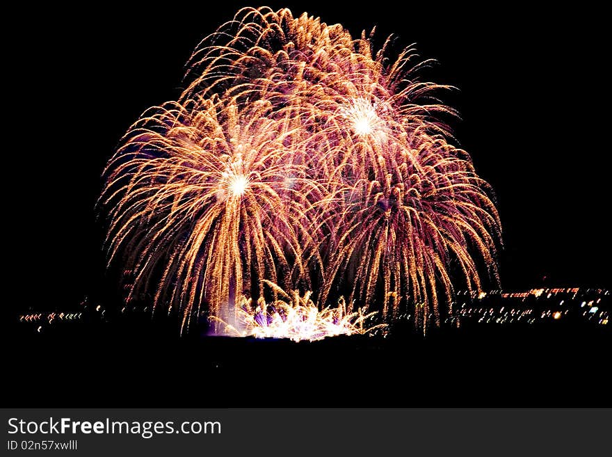 Firework streaks in night sky, celebration