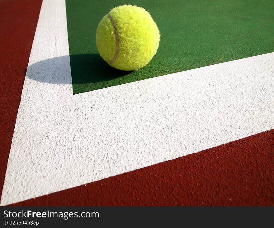 Tennis ball on the Corner of tennis court