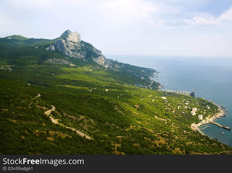 Crimean coastline, black sea surface under the summer sky