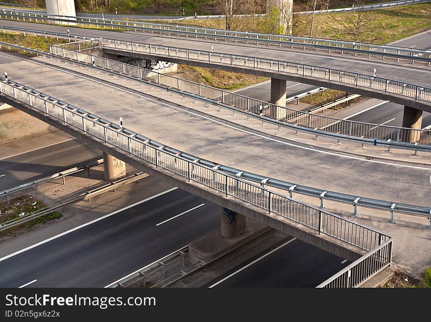 Empty highway with traffic signs in morning light - rush concept