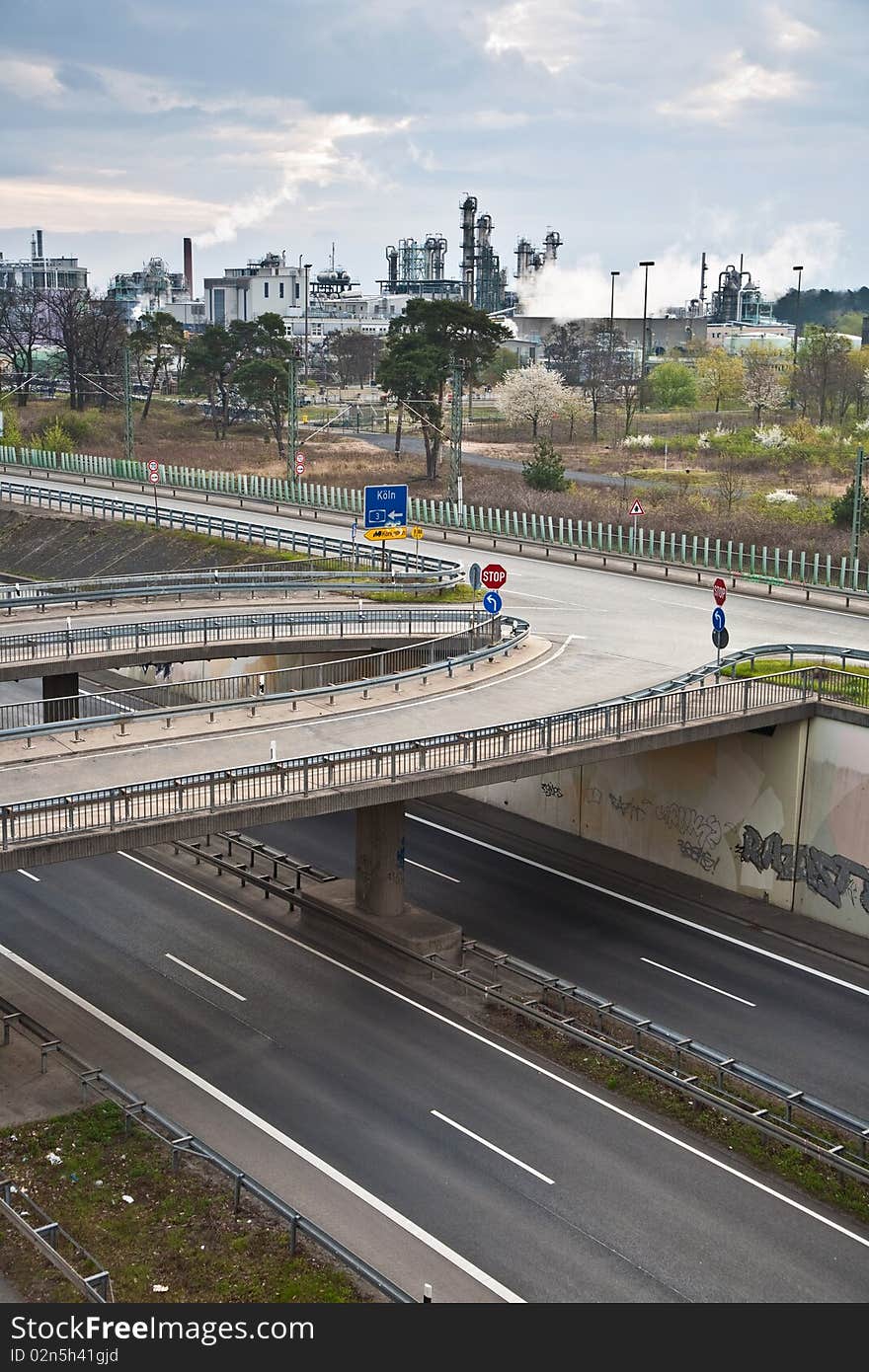 Empty highway with traffic signs and plant