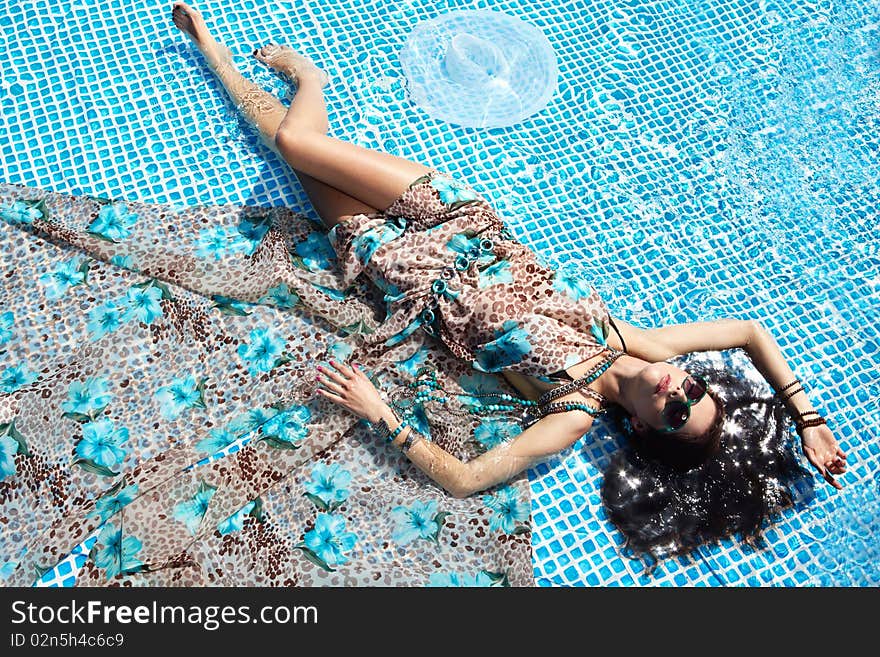 Girl Relaxing In A Pool