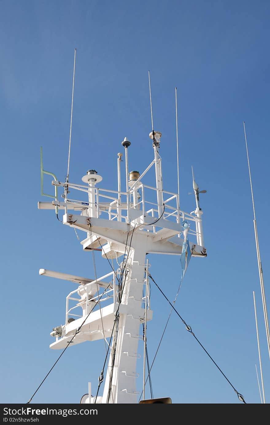 Ship's navigation instruments mounted on top of iron tower. Ship's navigation instruments mounted on top of iron tower