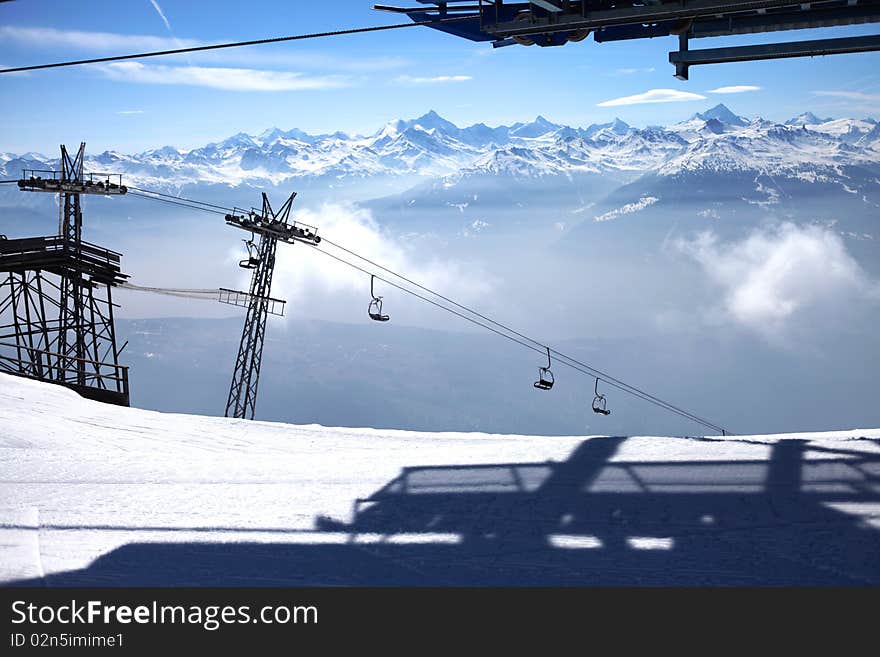 View of swiss mountain lifts and clouds