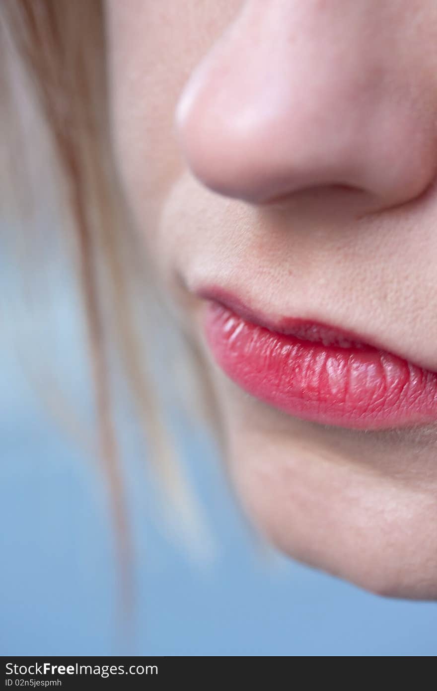 Closeup of pale healthy white woman's mouth with pink lips. Closeup of pale healthy white woman's mouth with pink lips