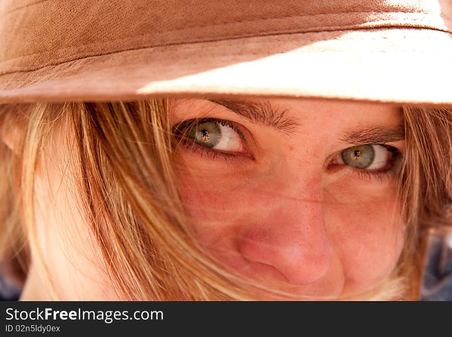 Closeup Of Green Eyes Of Attractive Blonde Girl