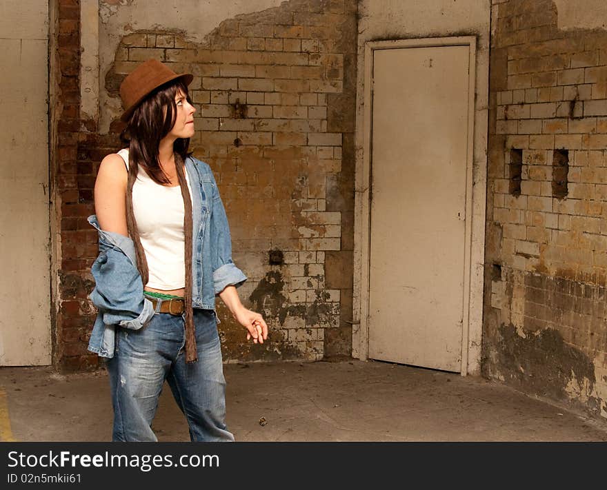 Trendy woman in denim in derelict building. Trendy woman in denim in derelict building