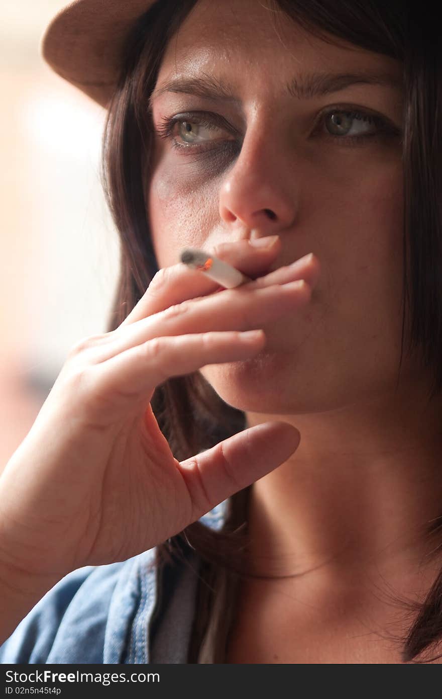 Fashionable Young Woman Smoking Cigarette