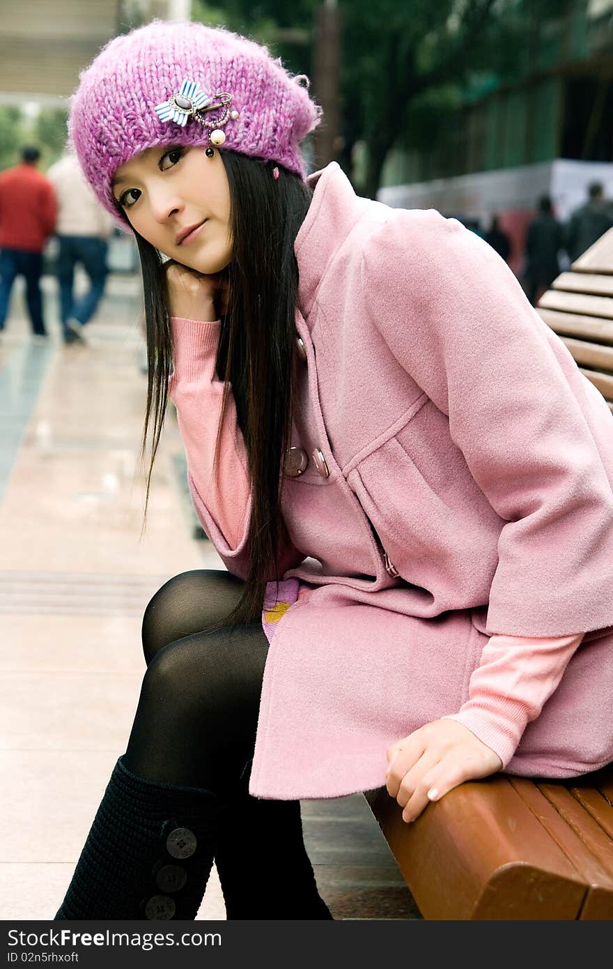 Beautiful girl sitting on bench