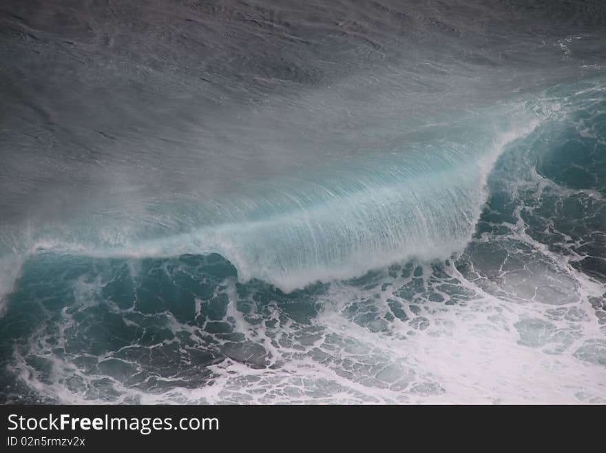 Huge dark green breaking wave and surf. Huge dark green breaking wave and surf