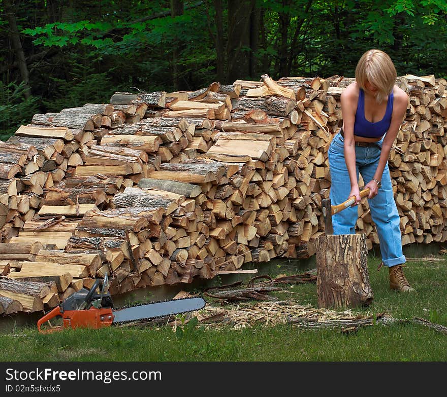 Girl splitting firewood