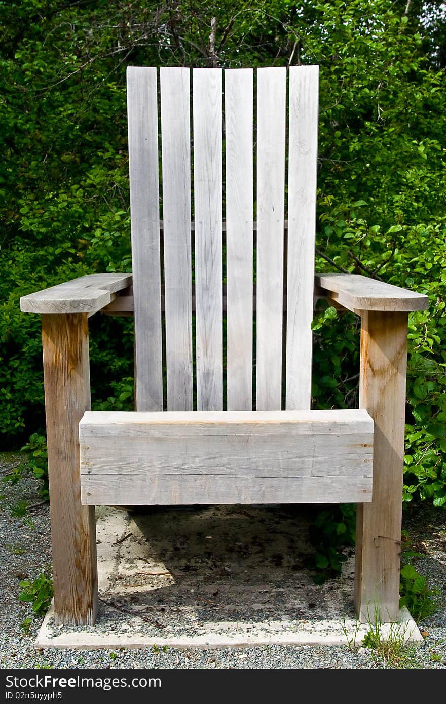 Oversized Park bench along the lake for people to read and relax in. Oversized Park bench along the lake for people to read and relax in