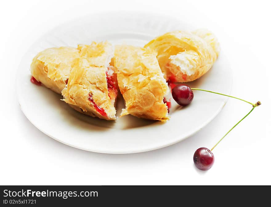 Fresh croissant with cherry