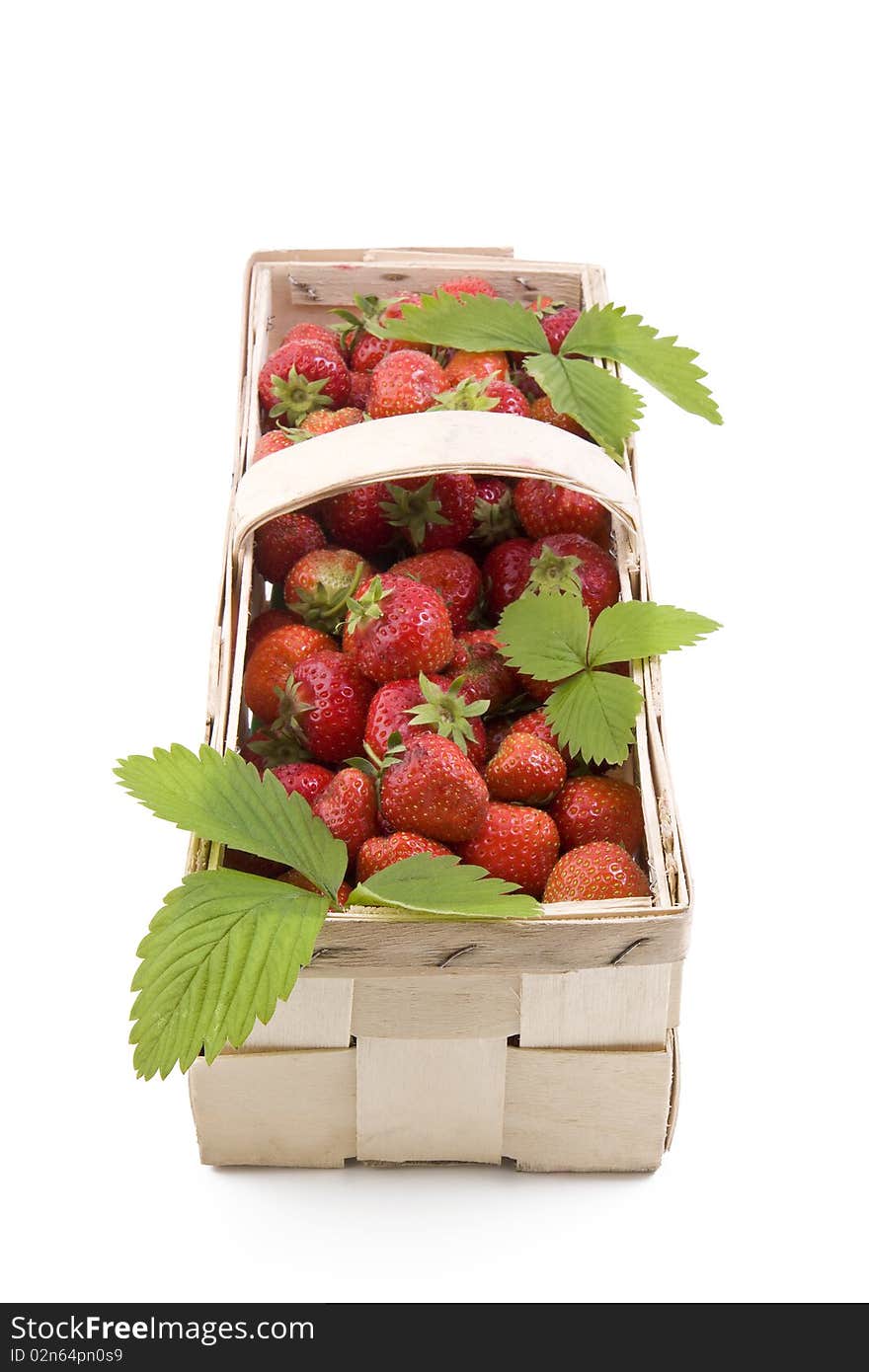 Fresh juicy strawberries in wooden basket isolated on white. Fresh juicy strawberries in wooden basket isolated on white