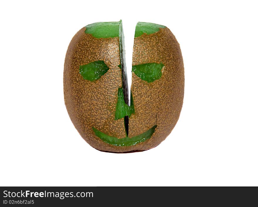 Head (eye, nose, mouth, bald head), cut out from the ripened fruit kiwi and cut  by a knife on two half. Head (eye, nose, mouth, bald head), cut out from the ripened fruit kiwi and cut  by a knife on two half