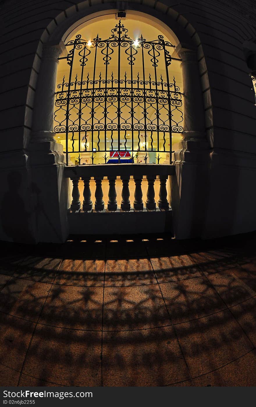 Old gate and shadows in the city