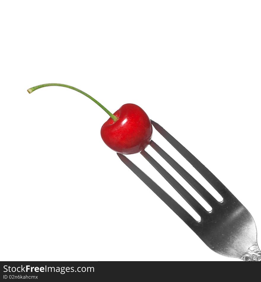 Red Cherry On Fork Isolated