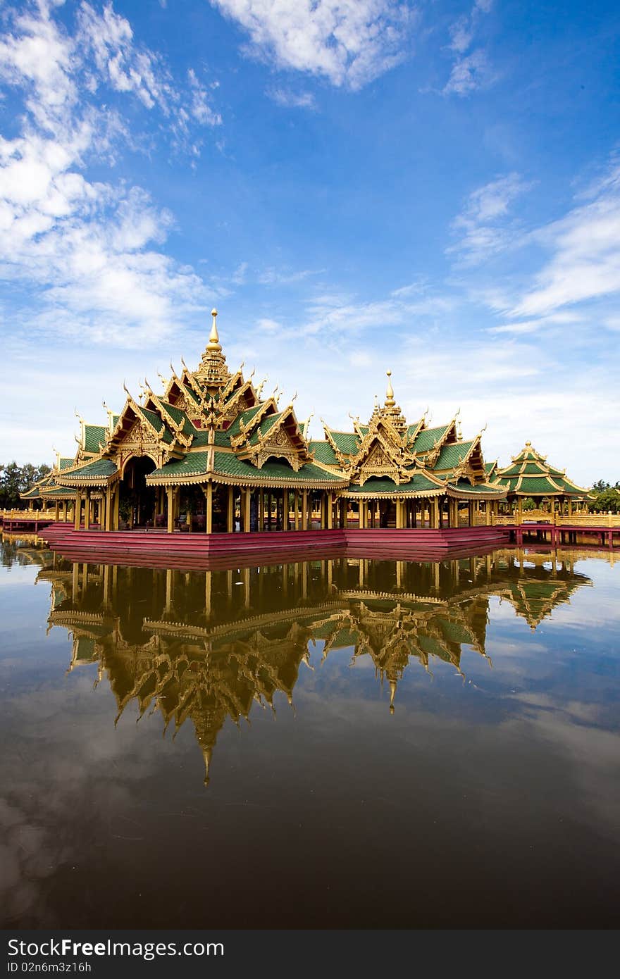 A green pavilion decorated by gold oriental texture on the lake. A green pavilion decorated by gold oriental texture on the lake