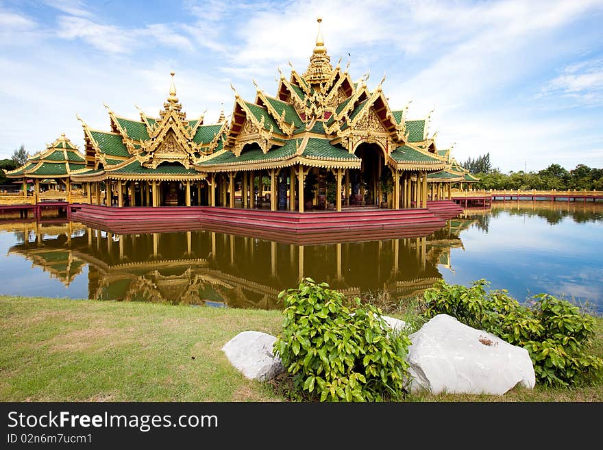 A green pavilion decorated by gold oriental texture on the lake. This is usually used for setting up traditional religious ceremony. A green pavilion decorated by gold oriental texture on the lake. This is usually used for setting up traditional religious ceremony