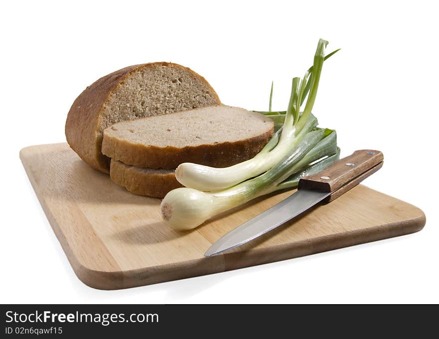 Slices of bread on a breadboard, isolated. Slices of bread on a breadboard, isolated