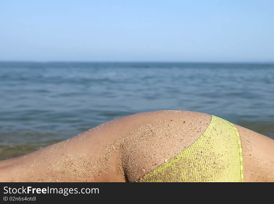 Woman body in front calm and sunny, empty beach. Woman body in front calm and sunny, empty beach.