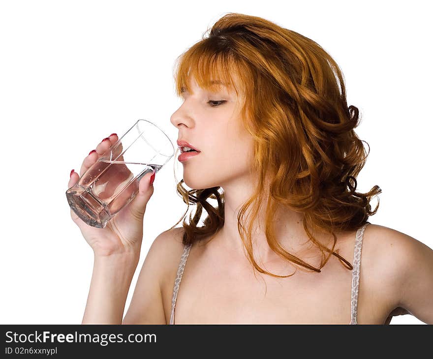 Redhead beautiful girl holding the glass of clean water. Redhead beautiful girl holding the glass of clean water.