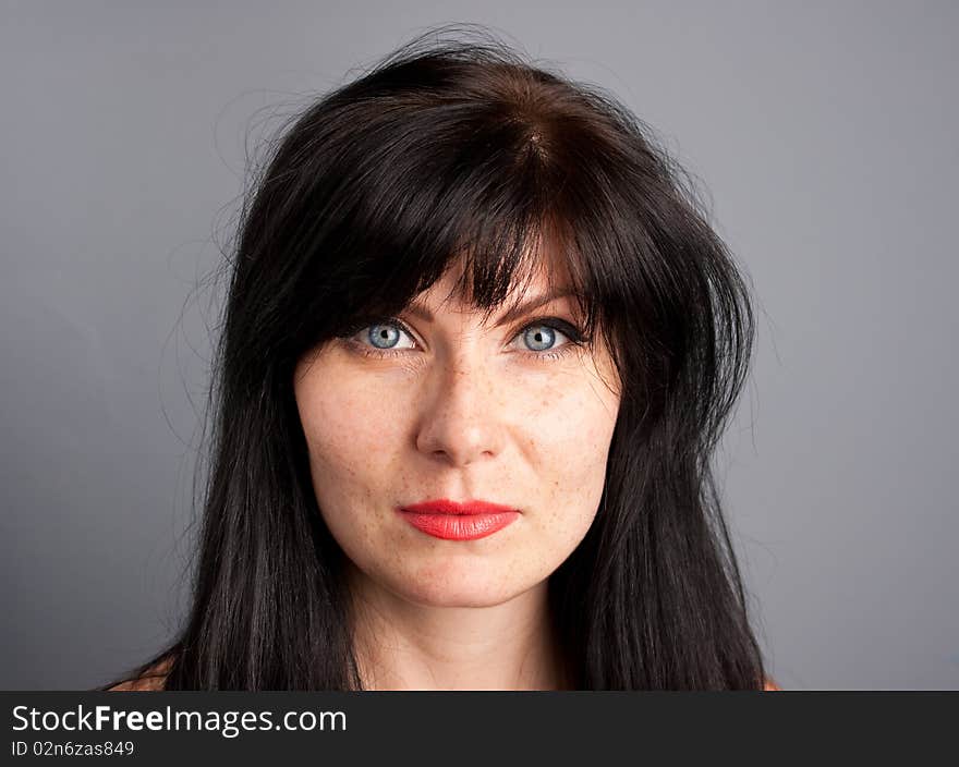 Woman's portrait with grey background