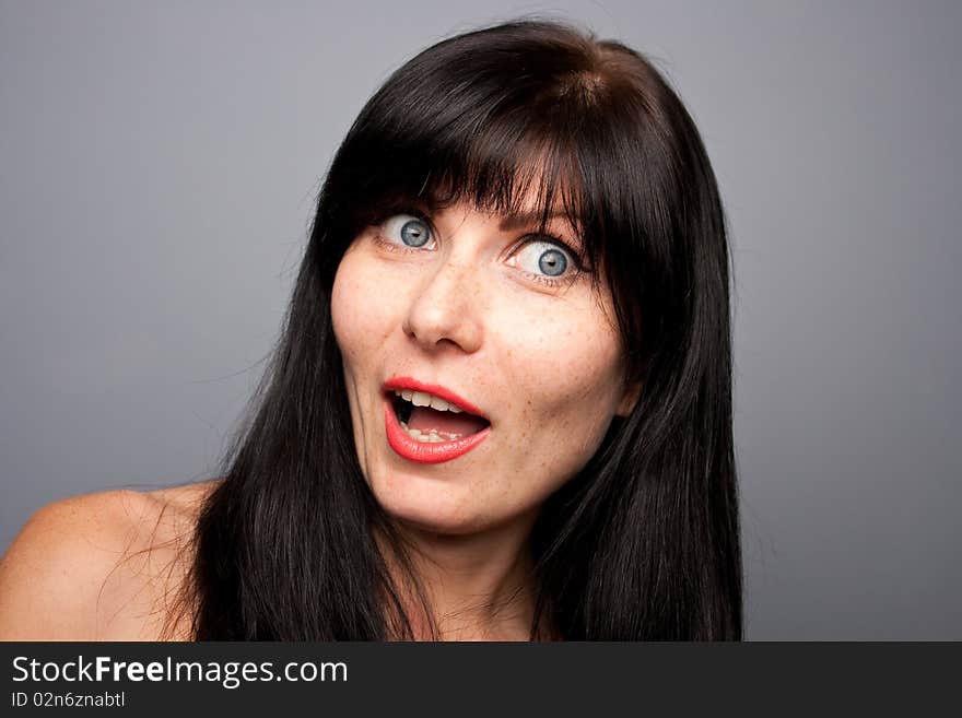 Woman's portrait with grey background