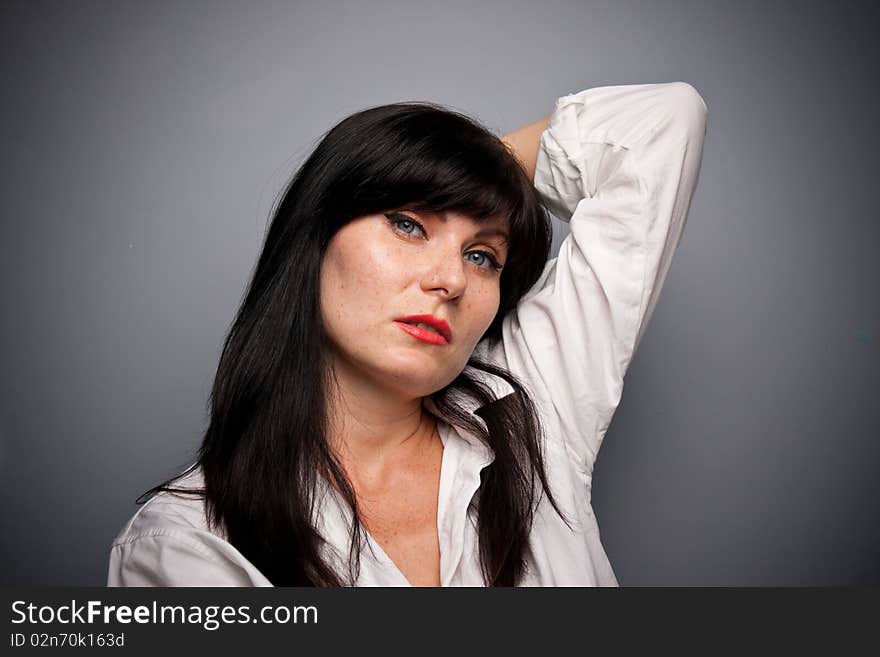 Woman's portrait with grey background