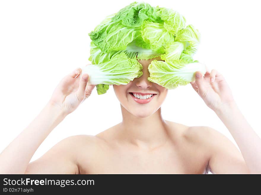 Shot of a beautiful young woman with cabbage headwear. Food concept, healthcare.