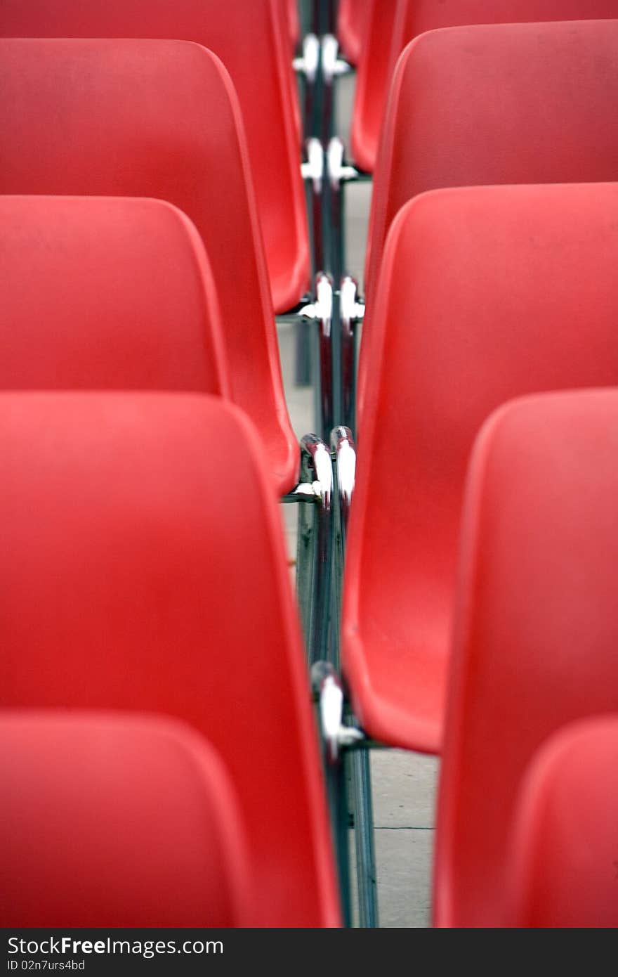 Red chairs in a square for a concert