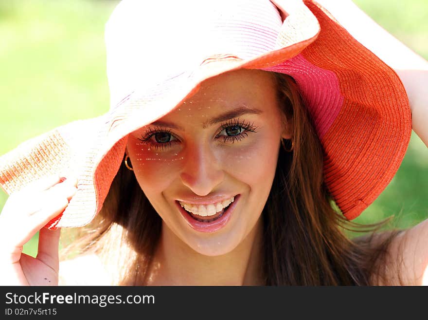 Pretty cheerful woman in the garden. Pretty cheerful woman in the garden