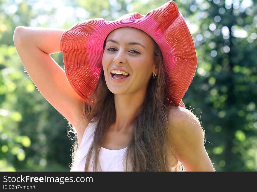 Pretty cheerful woman in the garden. Pretty cheerful woman in the garden